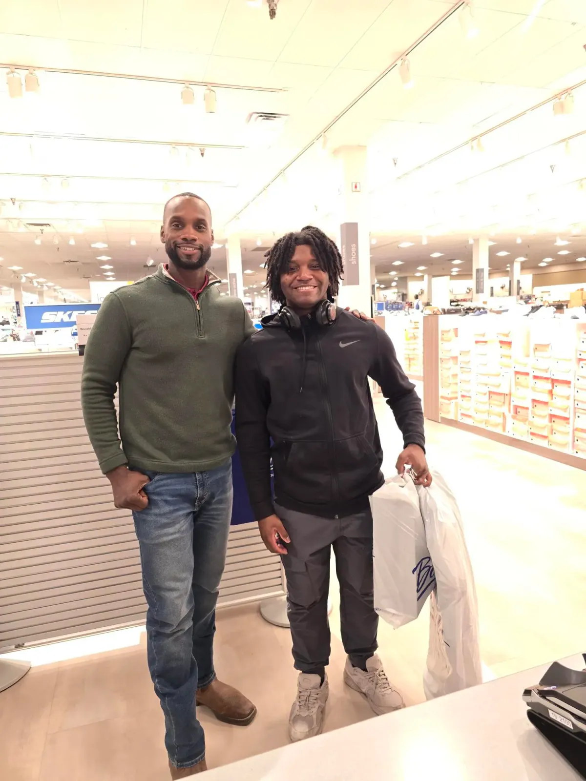 Michael Rascoe with a young person on a shopping trip